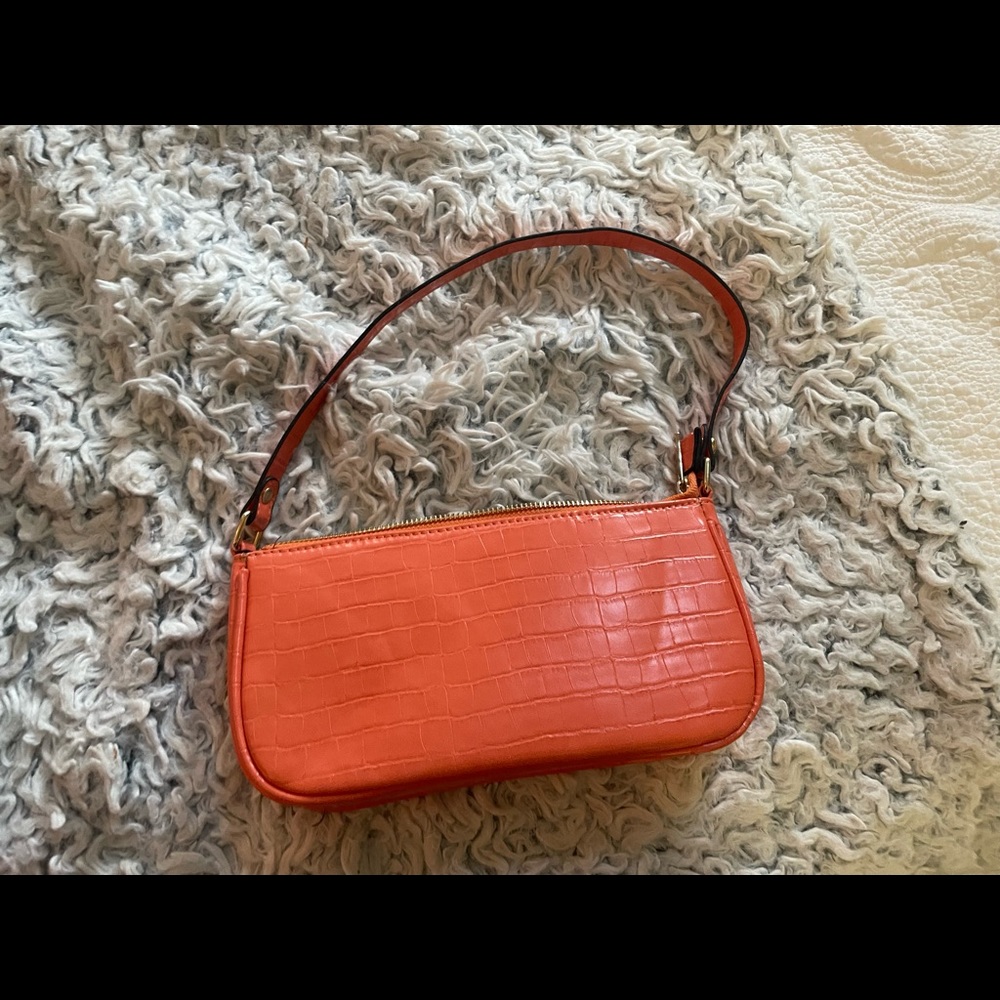 Cute little orange purse.